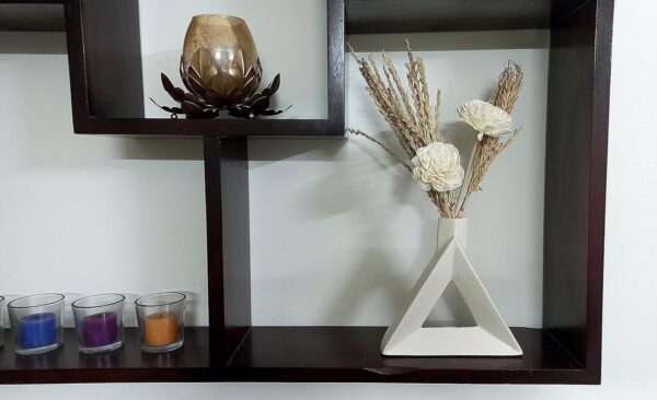 Modern home décor triangular vase with elegant flower arrangement