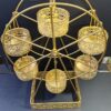 Metal Ferris wheel cupcake holder in gold for party decoration
