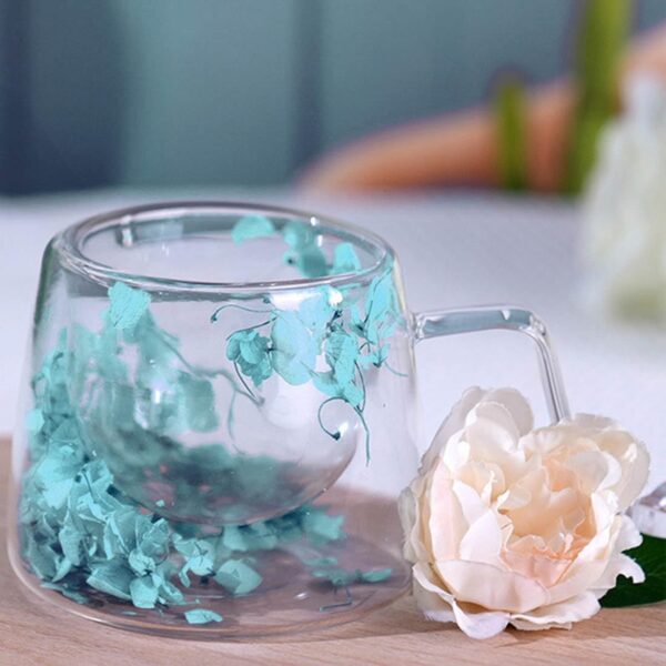 Elegant double wall glass mug featuring dried flower artwork