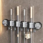 Grey multipurpose mop and broom holder for home cleaning tools