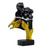 Decorative black and gold book-reading couple statue