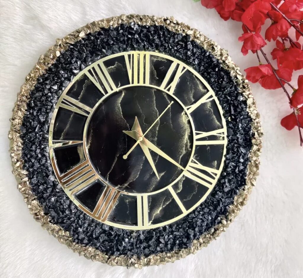 Designer black and golden resin wall clock with decorative stones
