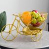 Space-saving bicycle shaped fruit rack with layered baskets