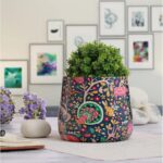 Designer metal pot for flowers with modern decorative pattern