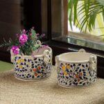 Handpainted ceramic flower pot with colorful artistic design