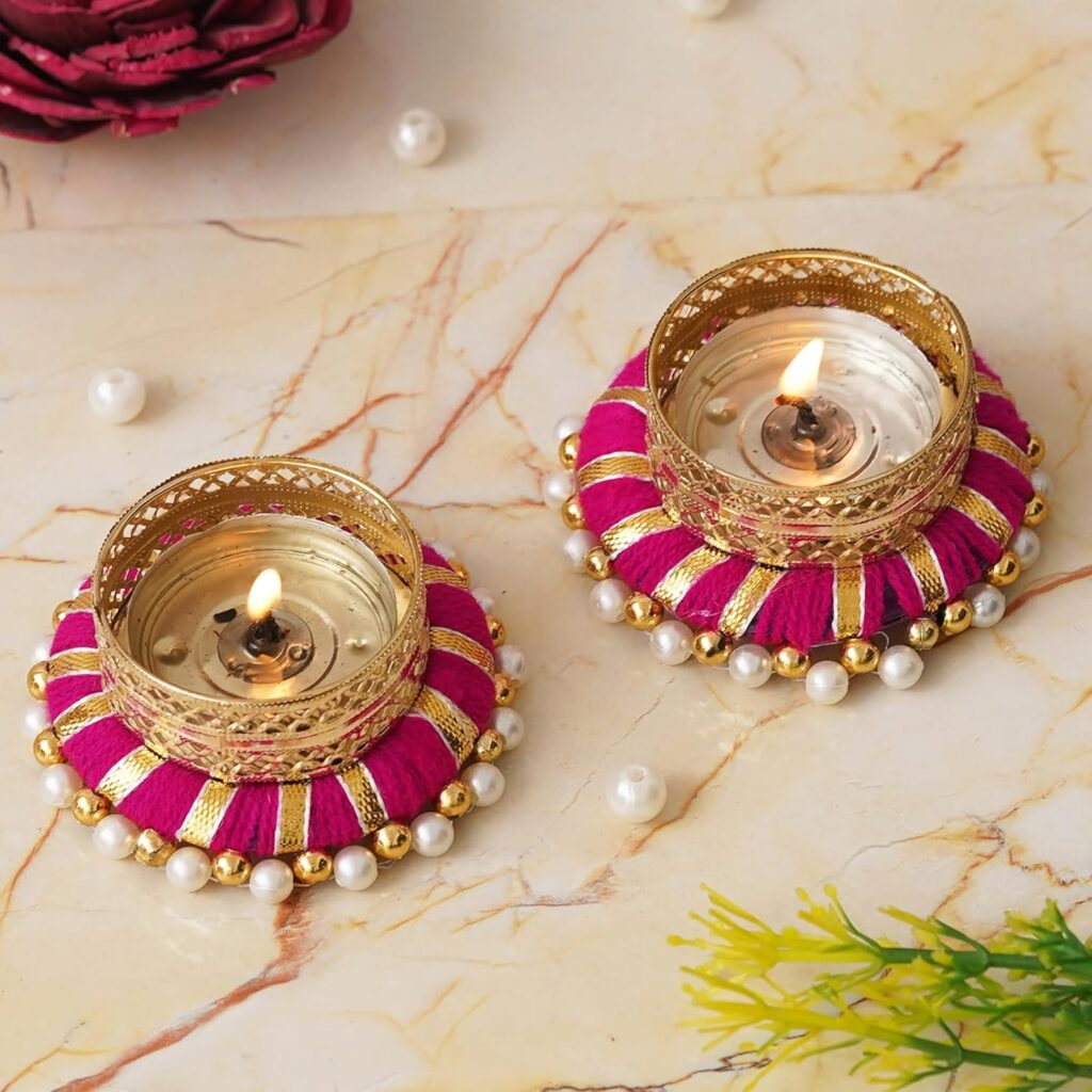 Designer golden and pink tea light candle holder for luxury interiors