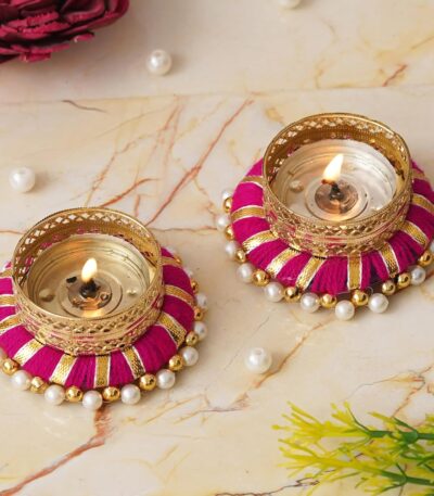 Designer golden and pink tea light candle holder for luxury interiors