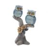 Owl couple tree statue symbolizing wisdom and togetherness