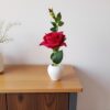 High-quality artificial red rose plant in pot for home décor