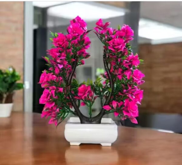 Faux rose plant in decorative pot for home styling