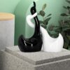 Elegant swan couple statue in glossy piano finish ceramic