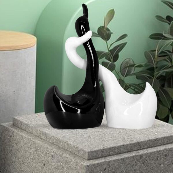 Elegant swan couple statue in glossy piano finish ceramic