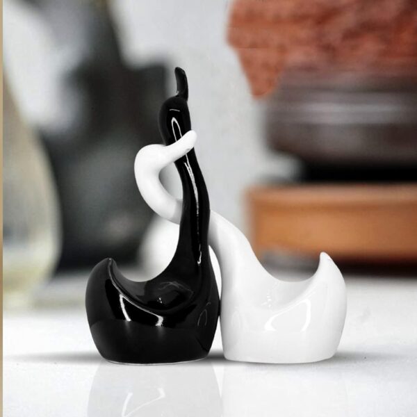 Stylish loving swan couple ceramic figurines with piano finish for home décor