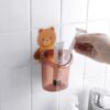 Wall mounted toothbrush holder with teddy bear design and tumbler