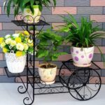 Vintage style plant stand trolley display with metal frame
