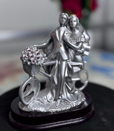 Cycle couple decorative showpiece adding charm and romance to home décor