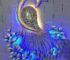 Artistic handcrafted peacock wall décor with LED lighting for elegant interiors